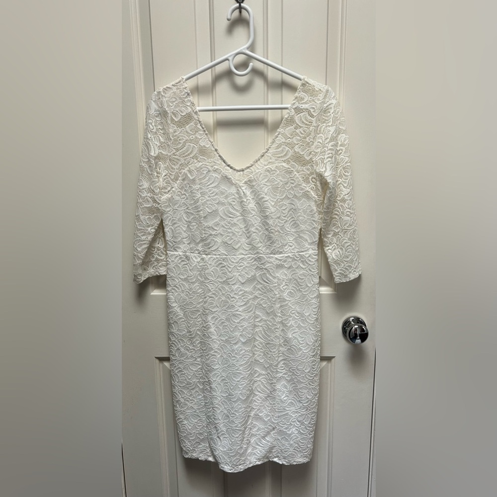 Ivory lace dress lined from bodice to hem.